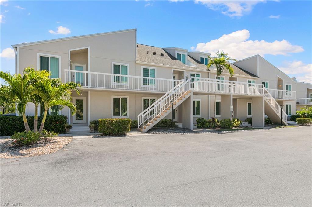 2149 San Marco Road, Unit 201 Marco Island, FL 34145 - Photo 20 of 22 front view of a house with a street