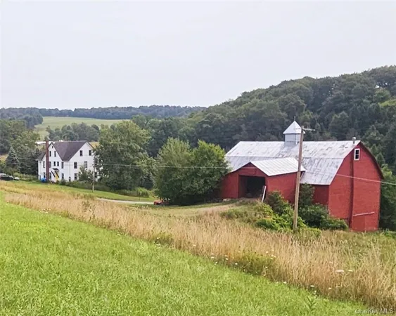 a view of a house with a yard and a large pool
