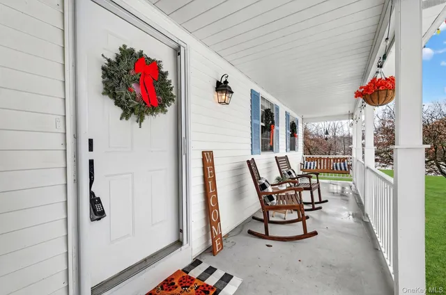 a view of a swimming pool with a bench and wooden fence