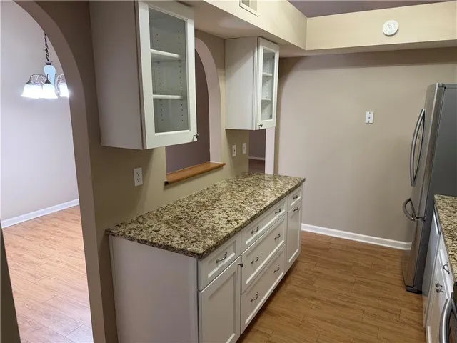 a kitchen with stainless steel appliances granite countertop a stove and a sink