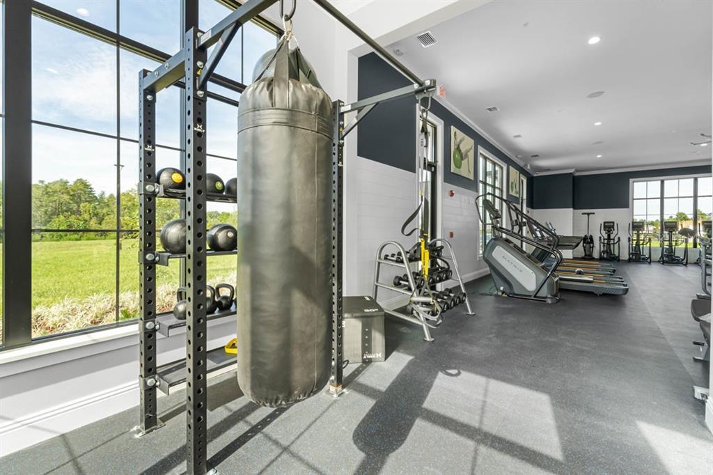 2959 House Finch Road St. Cloud, FL 34773 - Photo 22 of 52 a view of a room with gym equipment