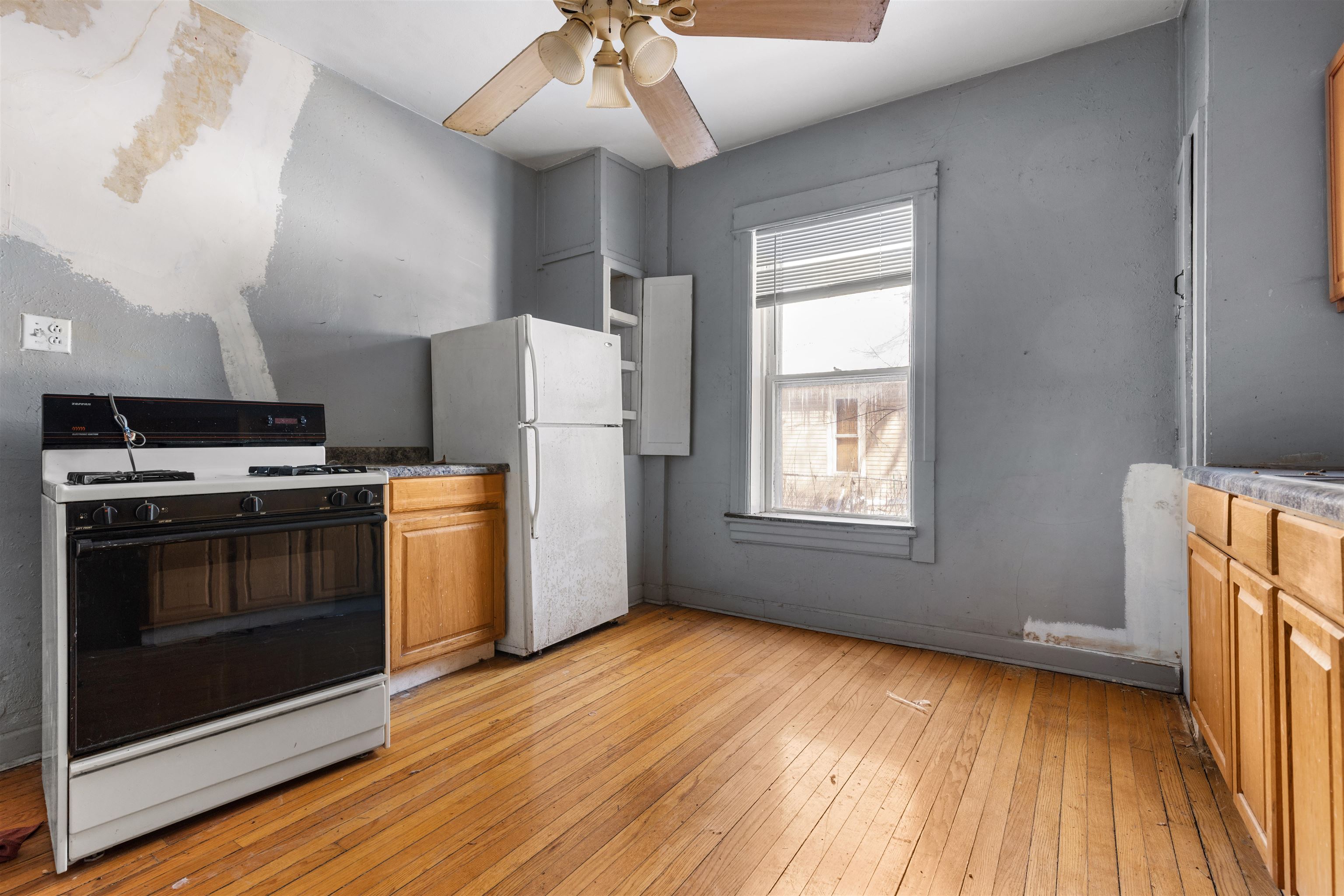 221 Rome Avenue Rockford, IL 61107 - Photo 12 of 26 a kitchen with stainless steel appliances a stove a sink and a refrigerator