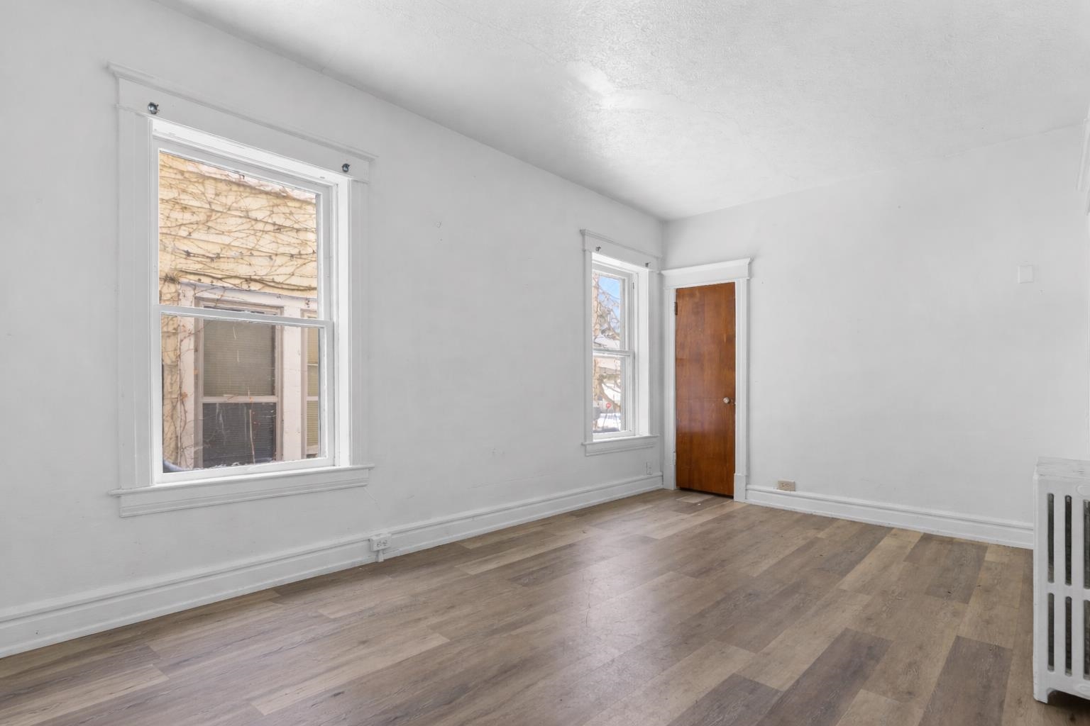 221 Rome Avenue Rockford, IL 61107 - Photo 15 of 26 an empty room with wooden floor and windows