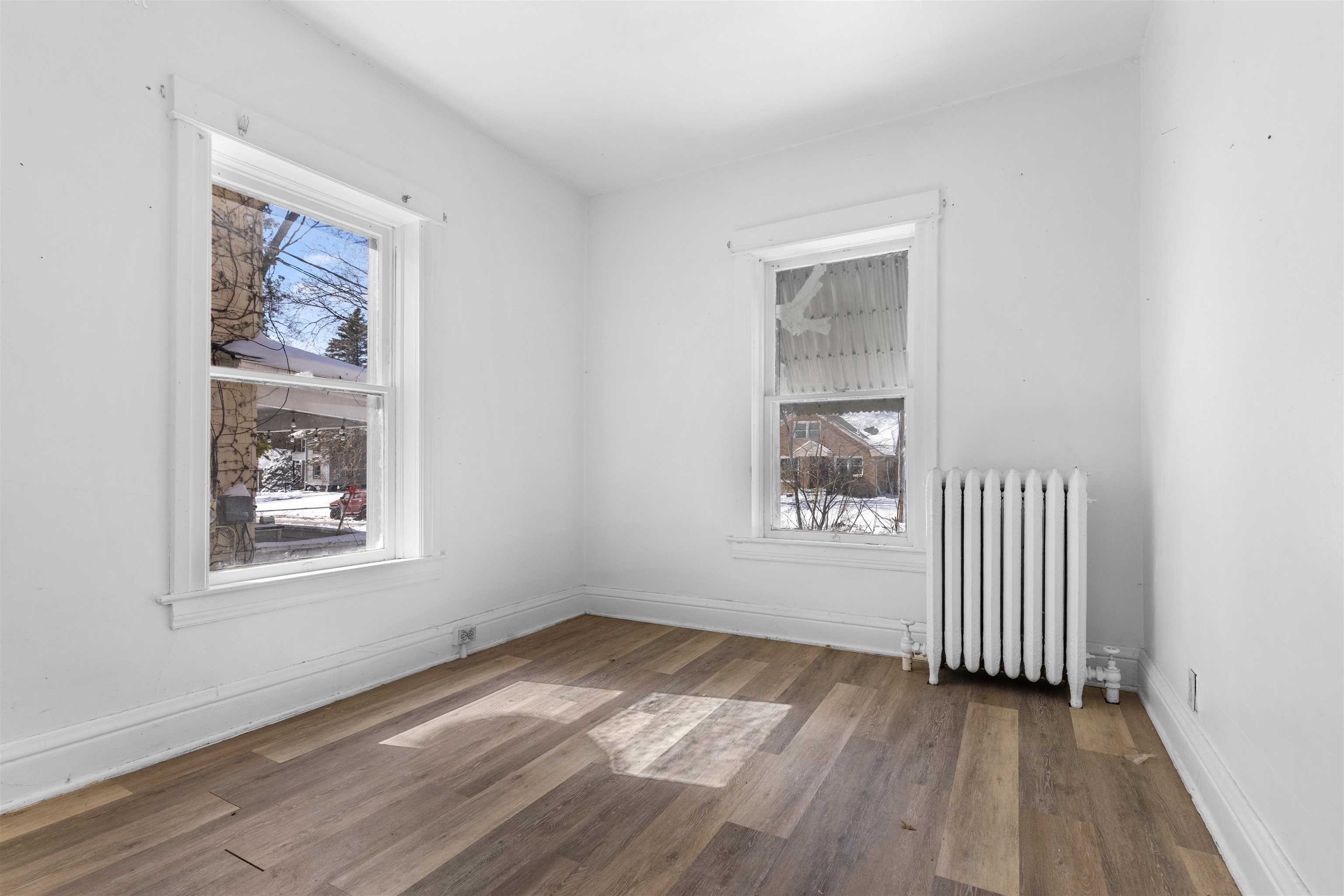 221 Rome Avenue Rockford, IL 61107 - Photo 18 of 26 an empty room with wooden floor and windows