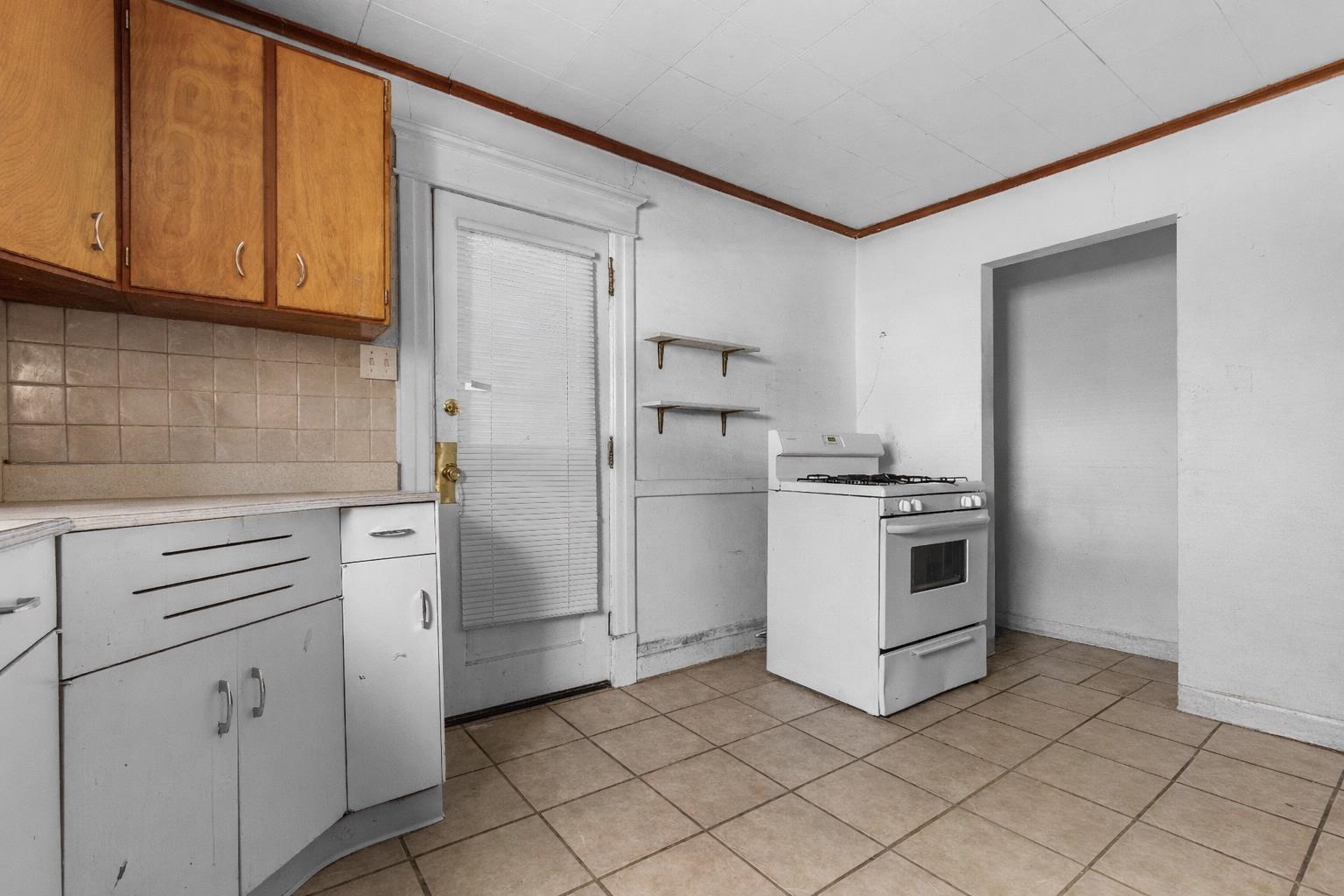 221 Rome Avenue Rockford, IL 61107 - Photo 20 of 26 a kitchen with white cabinets and white appliances