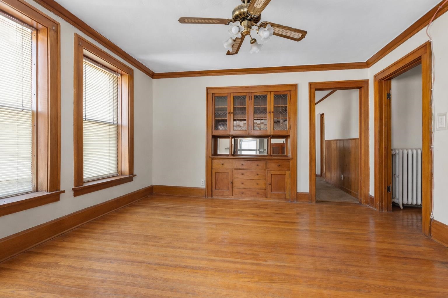 221 Rome Avenue Rockford, IL 61107 - Photo 21 of 26 a view of an empty room with a window and wooden floor