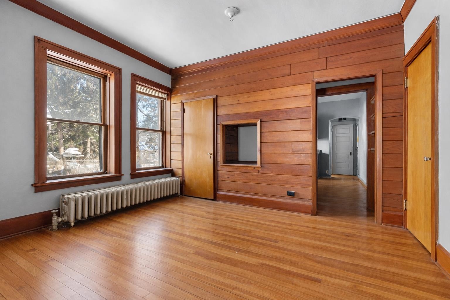 221 Rome Avenue Rockford, IL 61107 - Photo 8 of 26 a view of an empty room with wooden floor and a window