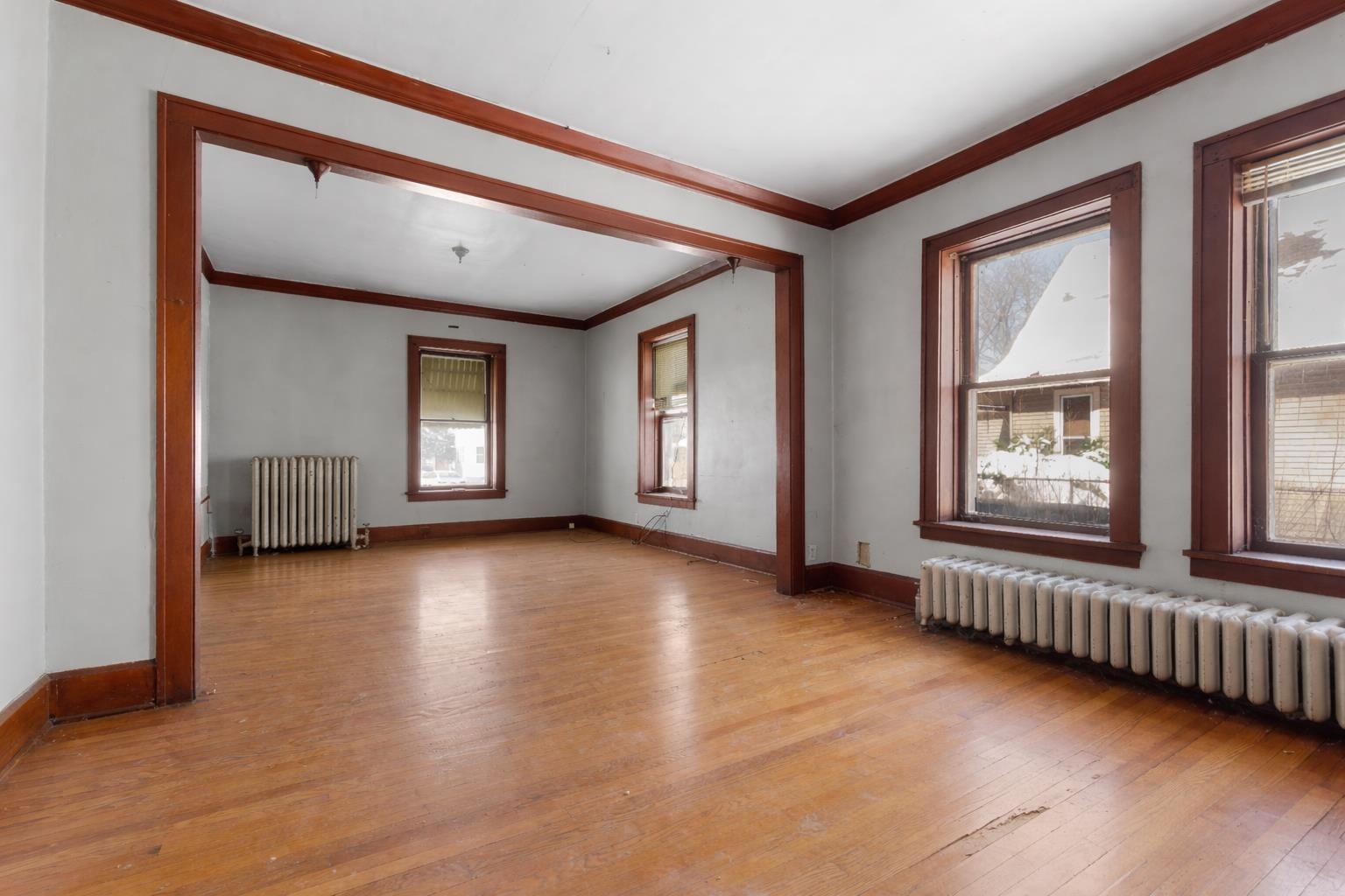 221 Rome Avenue Rockford, IL 61107 - Photo 10 of 26 a view of an empty room with a window and wooden floor