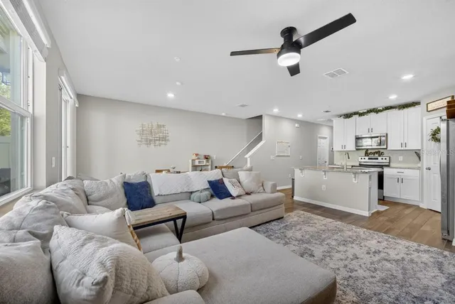 a living room with furniture and a large window