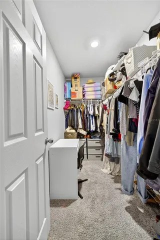 a view of storage and utility room with washer and dryer