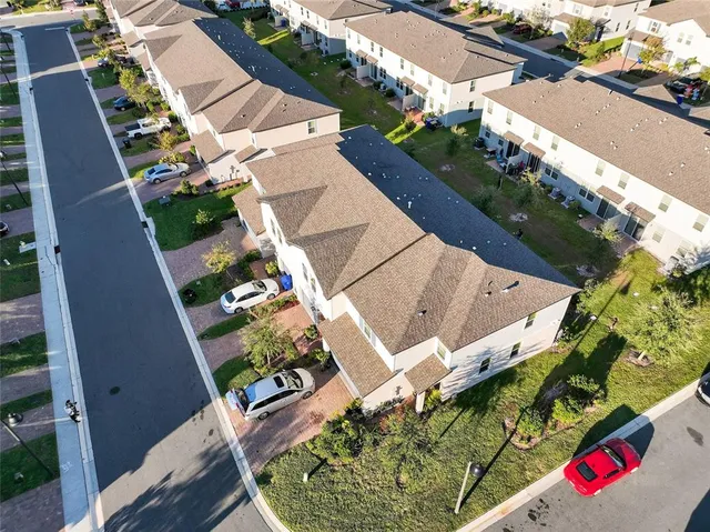 a front view of a house with a yard and a garage