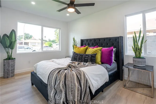 a bedroom with bed and a window