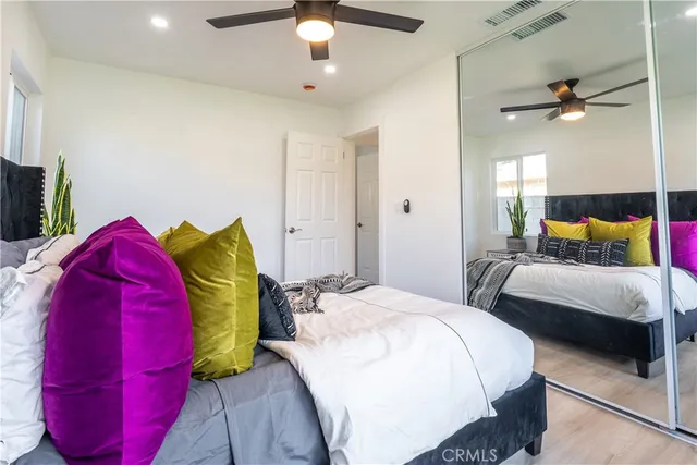 a bedroom with a bed and closet