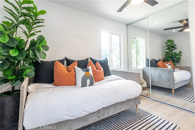 a bedroom with a bed and a couch