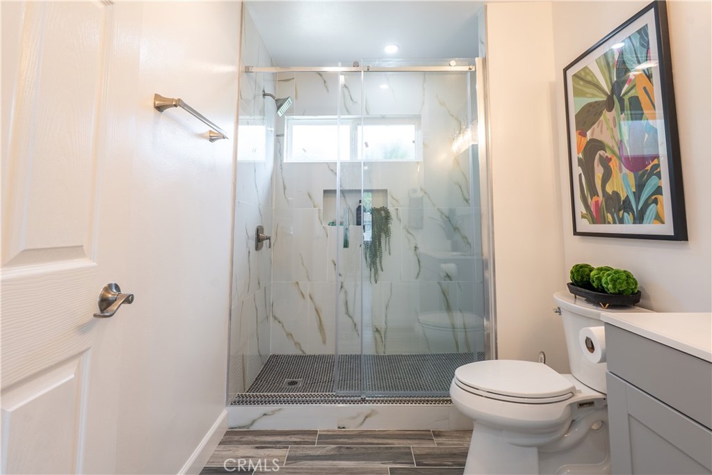 7516 San Juan Avenue Riverside, CA 92504 - Photo 21 of 43 a bathroom with a sink a toilet and shower