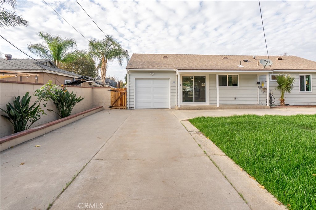 7516 San Juan Avenue Riverside, CA 92504 - Photo 25 of 43 a view of a house with a garden and pathway