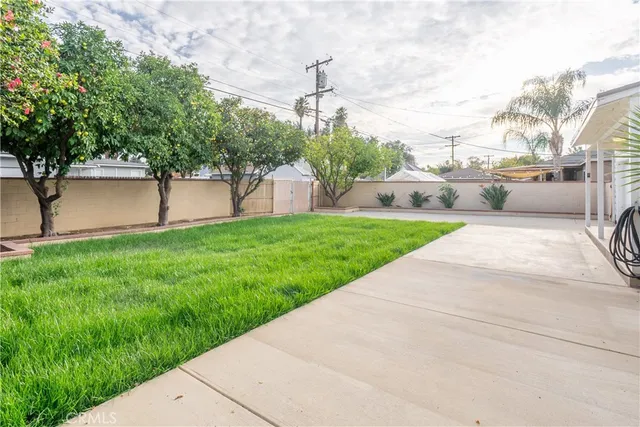 a view of backyard with a garden and plants