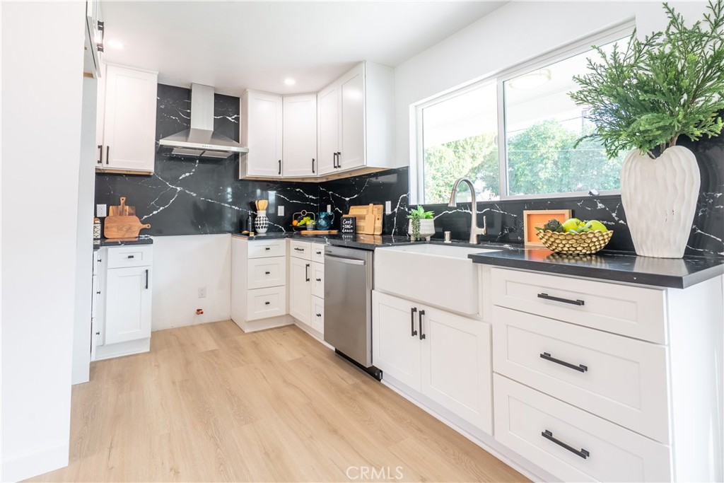 7516 San Juan Avenue Riverside, CA 92504 - Photo 3 of 43 a kitchen with white cabinets and window
