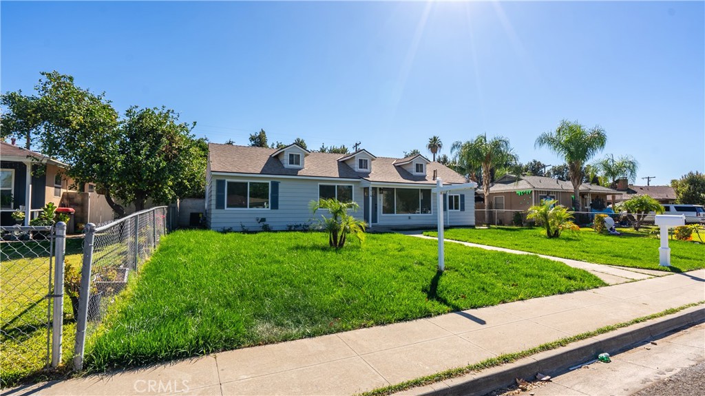 7516 San Juan Avenue Riverside, CA 92504 - Photo 37 of 43 a front view of a house with a yard table and chairs