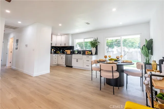 a kitchen with a table and chairs in it