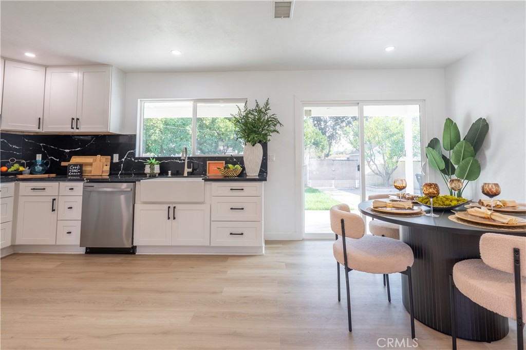 7516 San Juan Avenue Riverside, CA 92504 - Photo 8 of 43 a room with furniture a large window and wooden floor