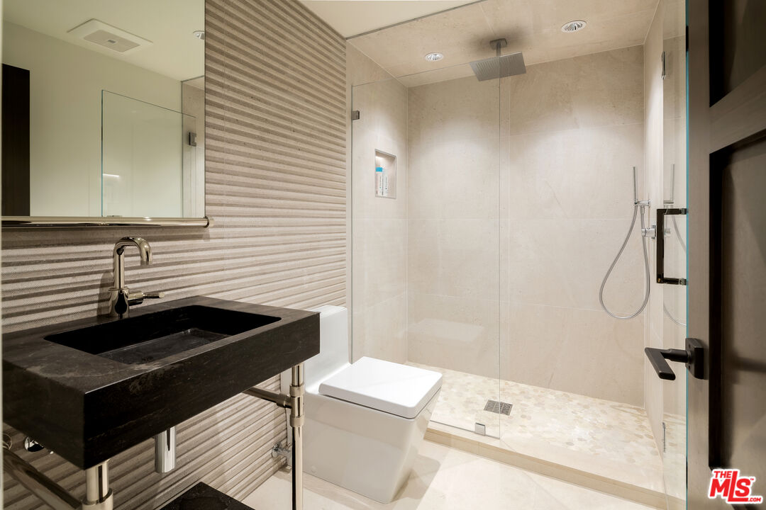335 Wrigley Road Avalon, CA 90704 - Photo 38 of 69 a bathroom with a sink a toilet and shower