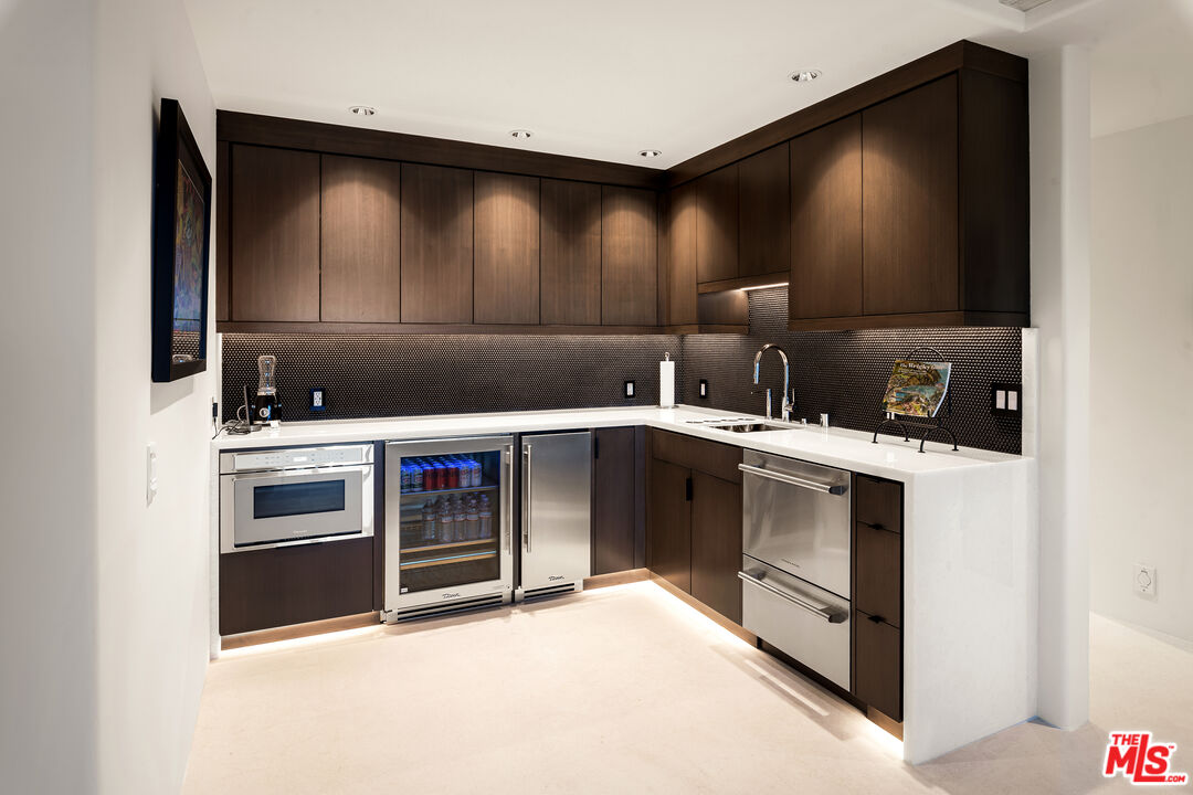 335 Wrigley Road Avalon, CA 90704 - Photo 41 of 69 a kitchen with stainless steel appliances a stove and a microwave