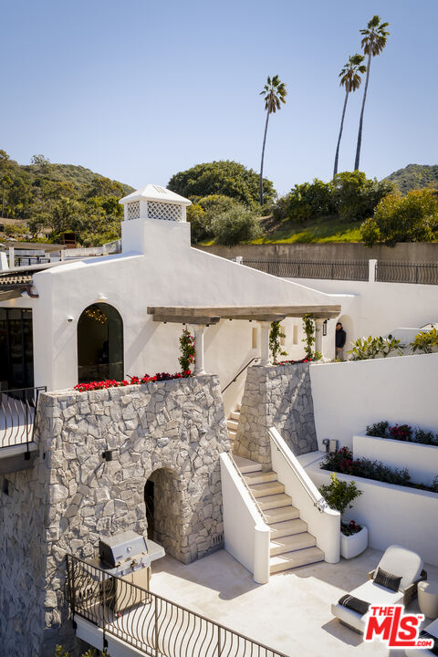 335 Wrigley Road Avalon, CA 90704 - Photo 53 of 69 a view of a balcony with two chairs and a table