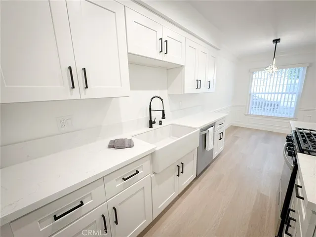 a kitchen with sink and window