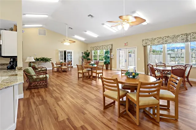 an aerial view of a house with a yard basket ball court and outdoor seating