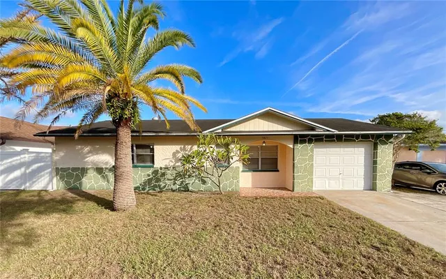 a view of a house with a yard