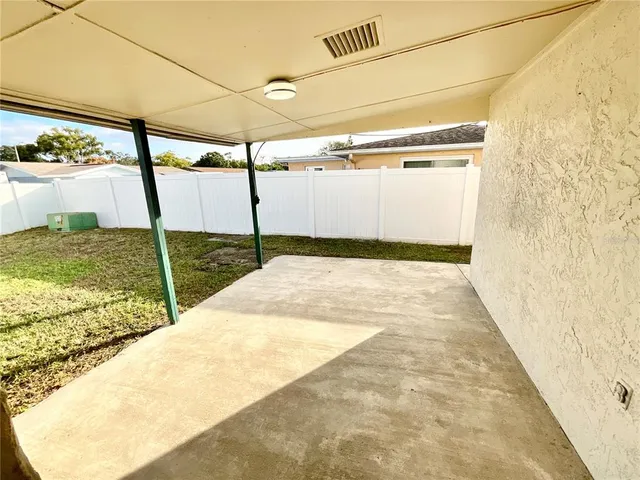 a view of a back yard of the house