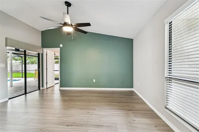 a kitchen with stainless steel appliances a stove top oven a sink dishwasher and a wooden floor