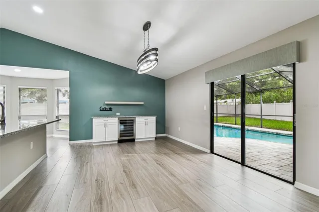 a view of a room with furniture and window