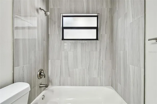 a view of backyard with tree