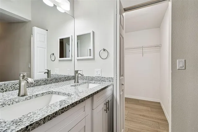 an aerial view of a house with a yard and large trees