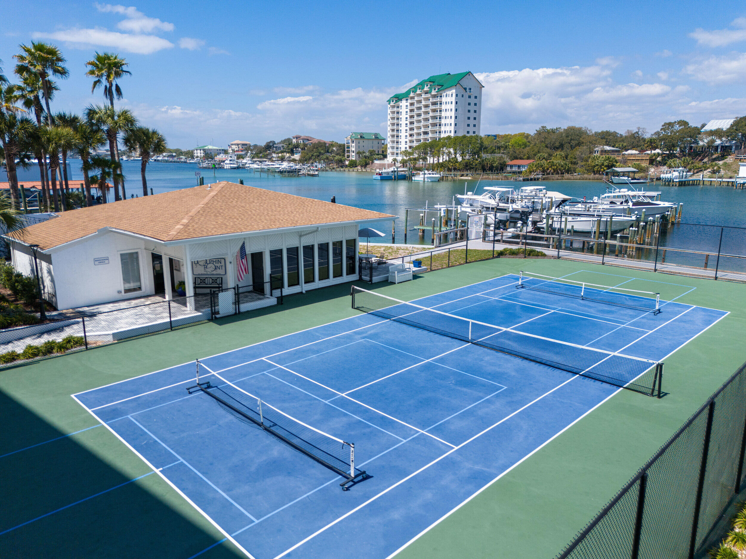 30 Moreno Point Road, Unit 305C Destin, FL 32541 - Photo 25 of 34 Tennis Court and Clubhouse