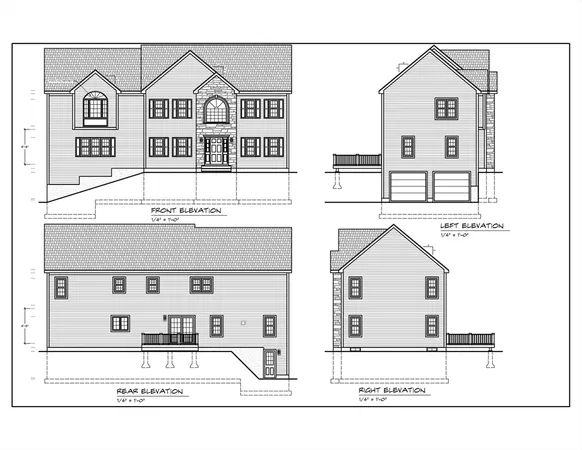a view of a white house with large windows