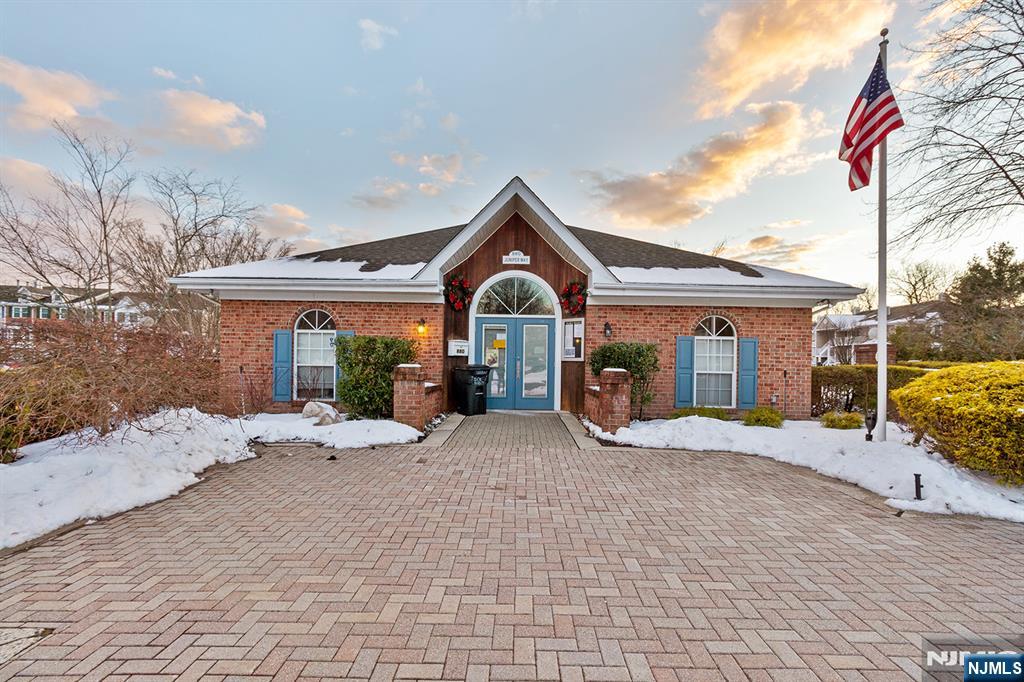 696 Pepperidge Road Mahwah, NJ 07430 - Photo 11 of 14 a front view of a house with a yard and garage