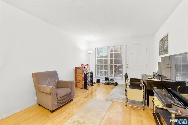 a living room with furniture stove and a table