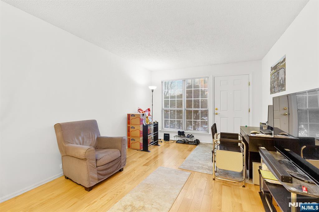 696 Pepperidge Road Mahwah, NJ 07430 - Photo 4 of 14 a living room with furniture stove and a table
