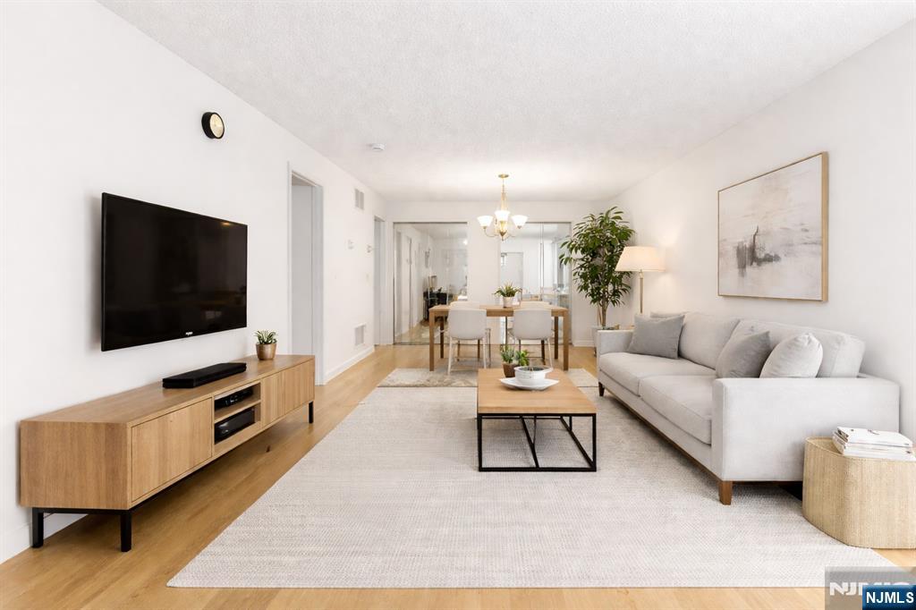 696 Pepperidge Road Mahwah, NJ 07430 - Photo 5 of 14 a living room with furniture and a flat screen tv