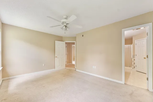 a spacious bathroom with a bathtub and a sink