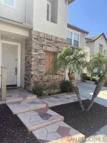 a view of a potted plants in front of a house