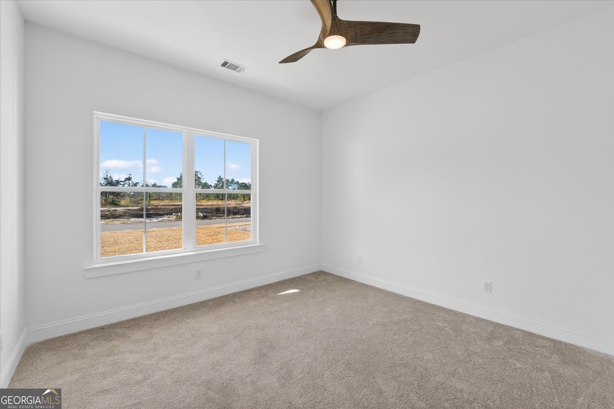 1058 Cottage Way Darien, GA 31305 - Photo 13 of 20 an empty room with a window