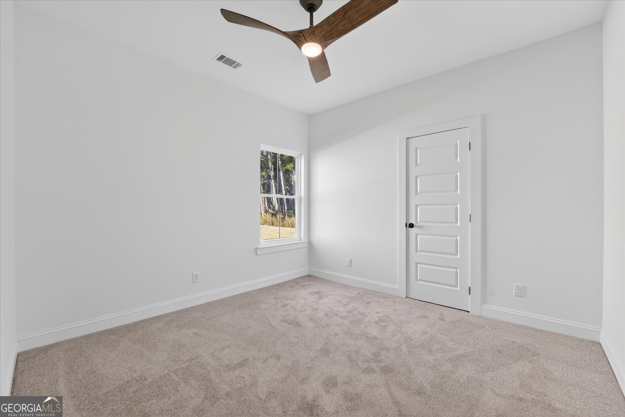 1058 Cottage Way Darien, GA 31305 - Photo 14 of 20 an empty room with windows and fan