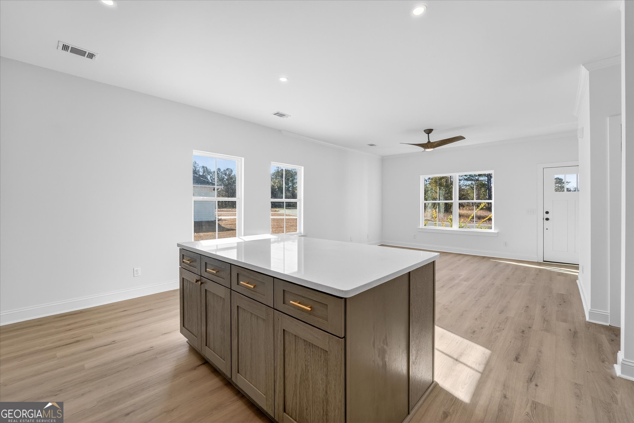 1058 Cottage Way Darien, GA 31305 - Photo 9 of 20 a kitchen with a wooden floor and window