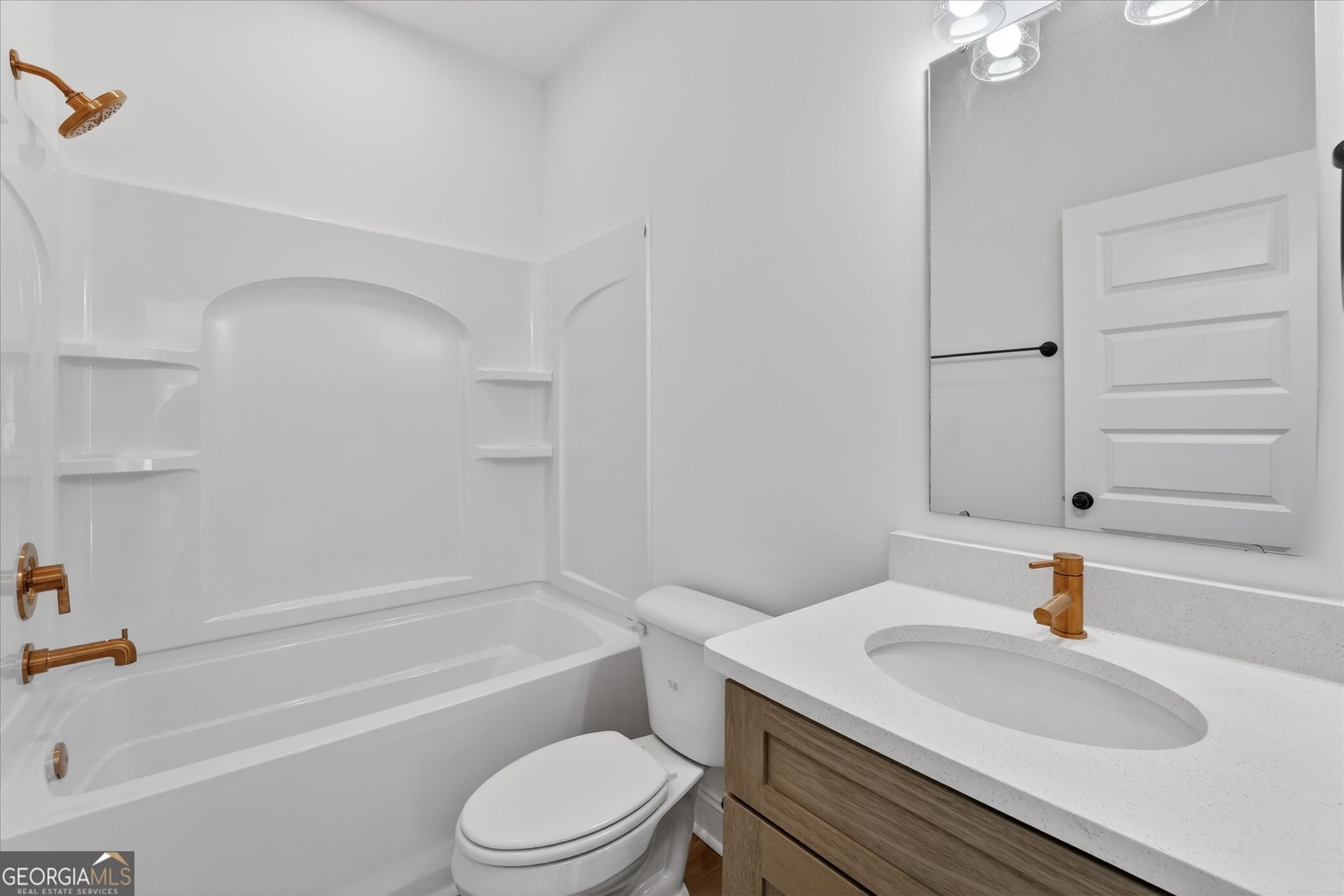 1058 Cottage Way Darien, GA 31305 - Photo 10 of 20 a bathroom with a sink a toilet and shower