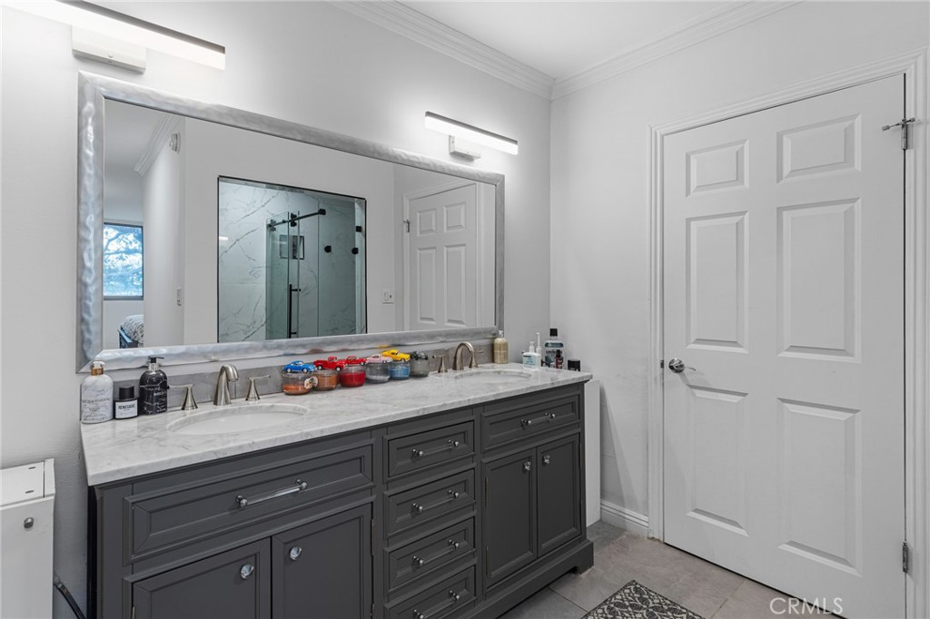 8701 Delgany Avenue, Unit 110 Playa del Rey, CA 90293 - Photo 13 of 22 a bathroom with a double vanity sink and a mirror