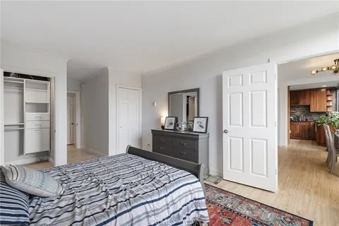 a bedroom with a bed and a view of bedroom